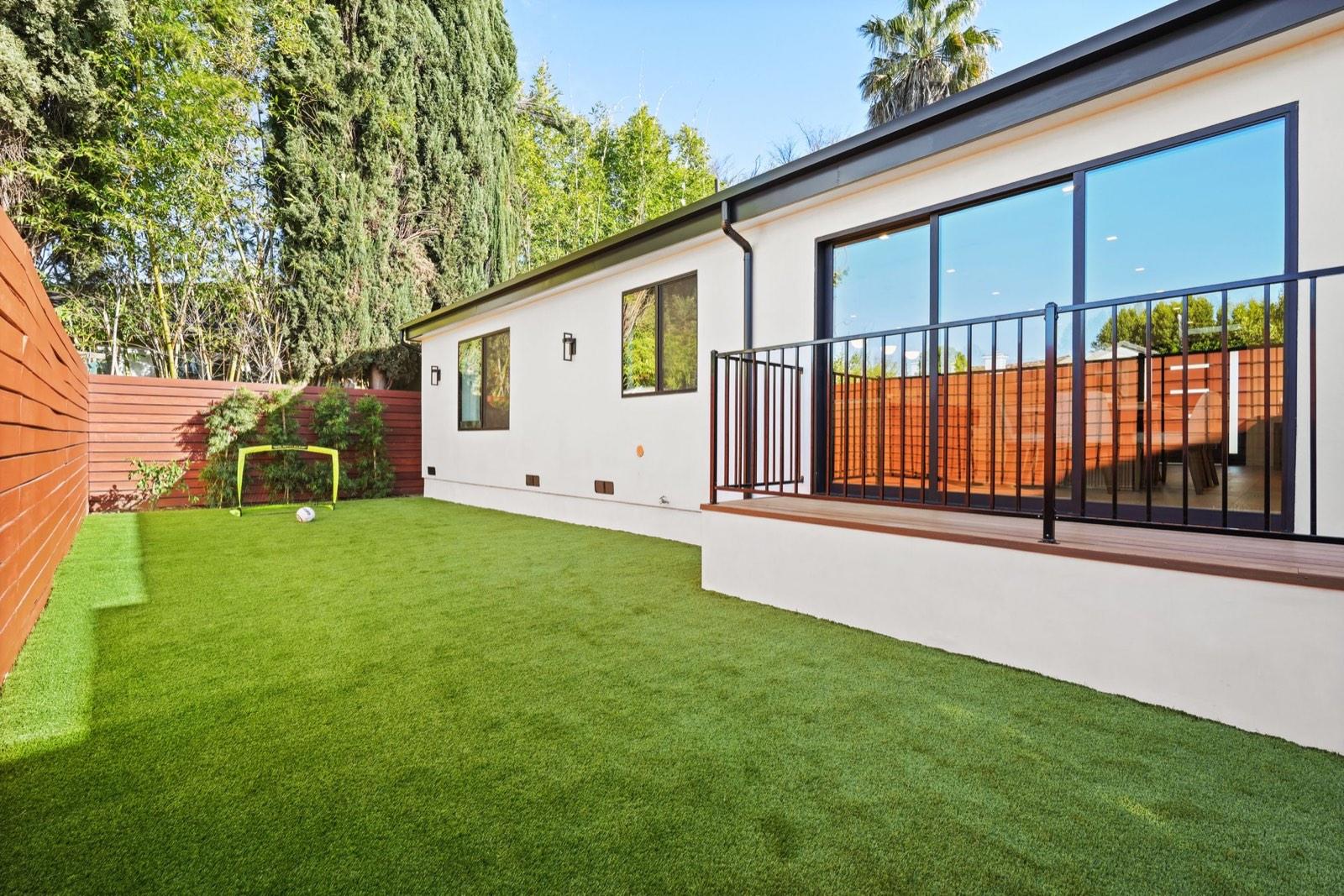 Rear elevation and lawn seen from the back of the property