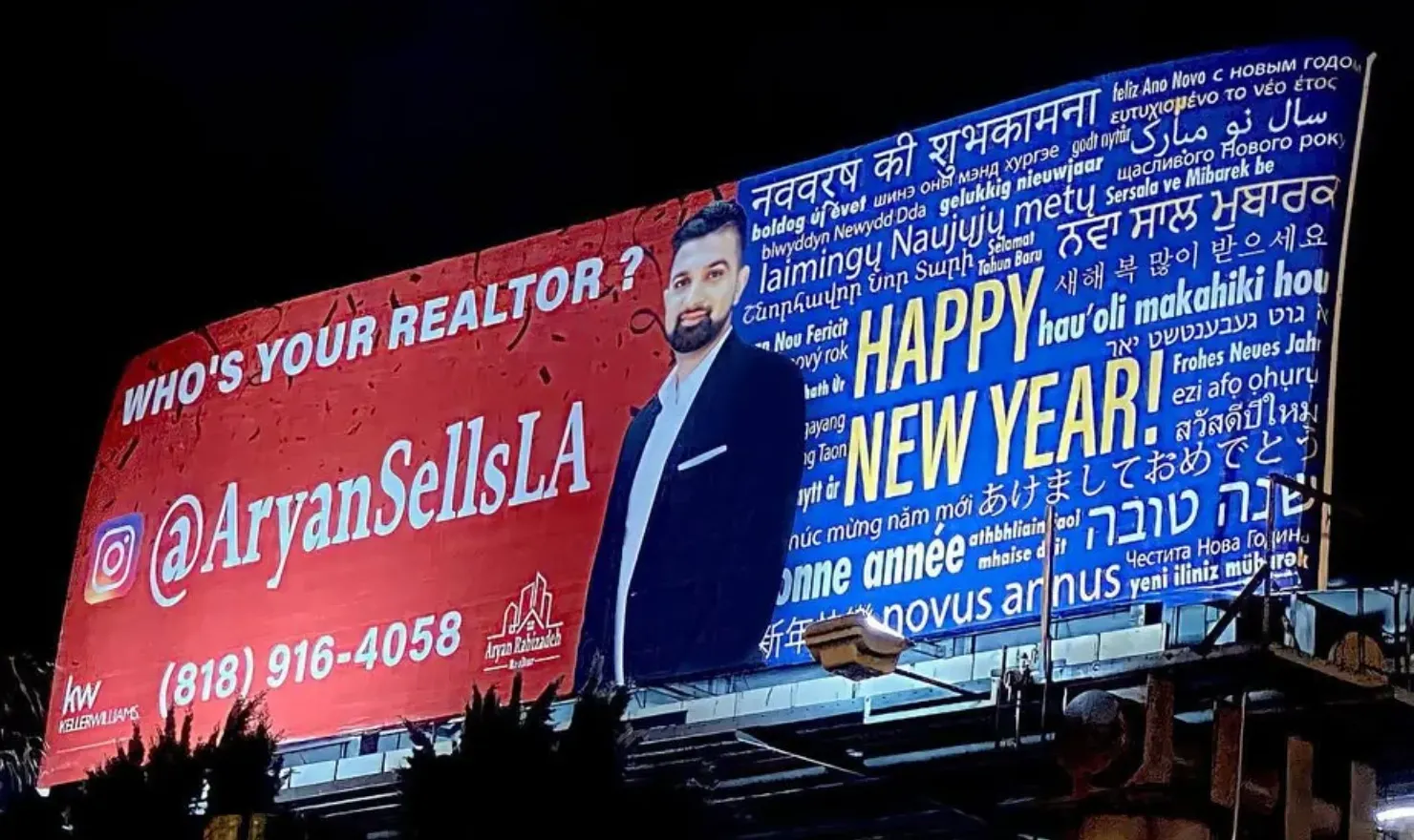 Aryan Rabizadeh's past AryanSellsLA billboard advertisement at night, with a Happy New Year message